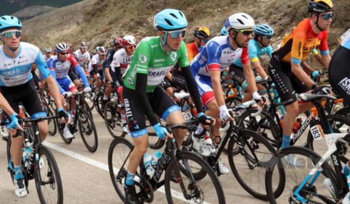 Martin (tengah) memenangi peringkat pertama jelajah utama di Vuelta pada 2011. FOTO Agensi