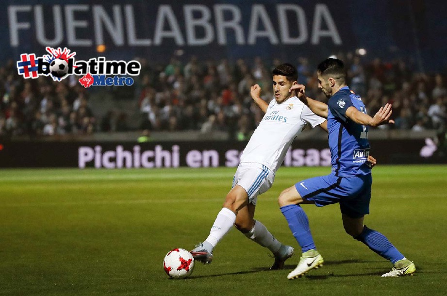 ASENSIO (kiri) jaring gol pertama Real dengan sepakan penalti selepas Hakimi di jatuhkan Garcia. -Foto EPA
