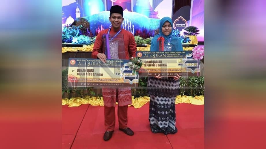 FAKHRUL (kiri) bersama Nurul Husna Sharif selaku johan qariah Johan Pertandingan Tilawah al-Quran Peringkat Negeri Kedah. FOTO Ihsan Mohd Fakhrul Radhi