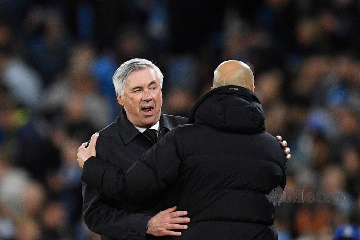 ANCELOTTI (kira) dan pengurus Manchester City Pep Guardiola.-FOTO AFP 