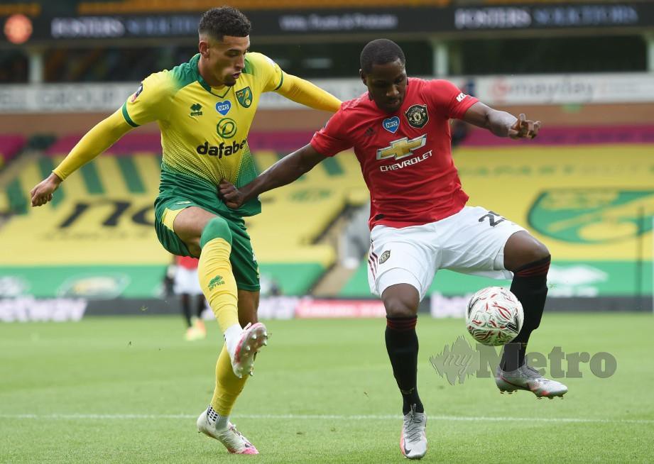 IGHALO (kanan) memainkan peranan penting ketika United mengalahkan Norwich 2-1 awal pagi tadi. FOTO AFP