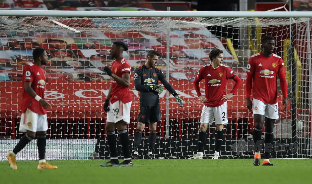 PEMAIN United kecewa selepas gagal untuk meraih tiga mata di laman sendiri. FOTO AFP