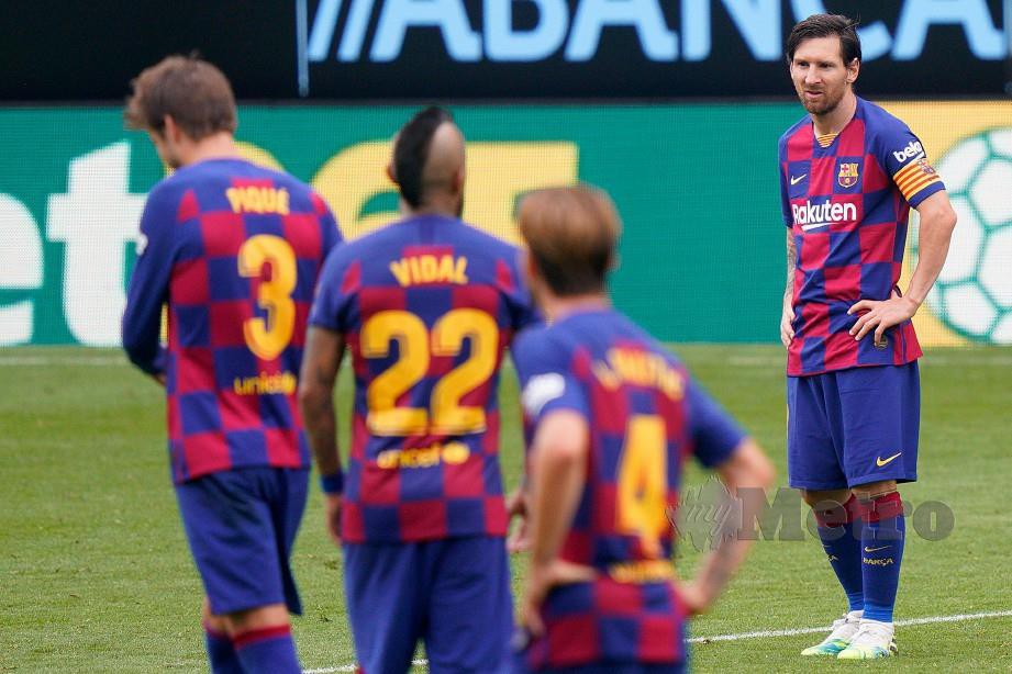 REAKSI Messi selepas pasukanya mencatat keputusan seri menentang Celta awal pagi tadi. FOTO AFP