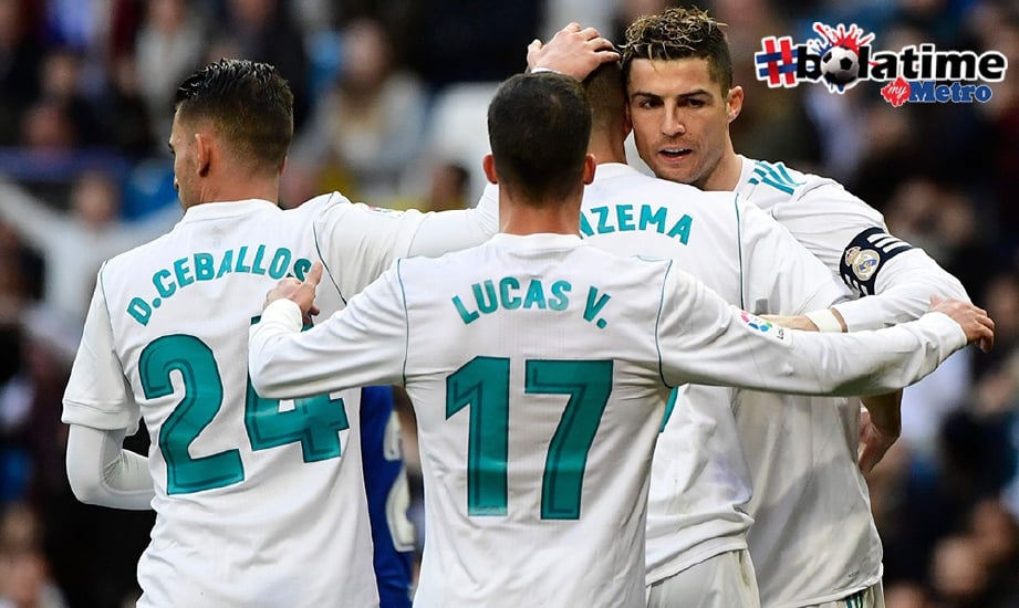 RONALDO (kanan) meraikan gol bersama Benzema (dua dari kanan). FOTO/AFP 
