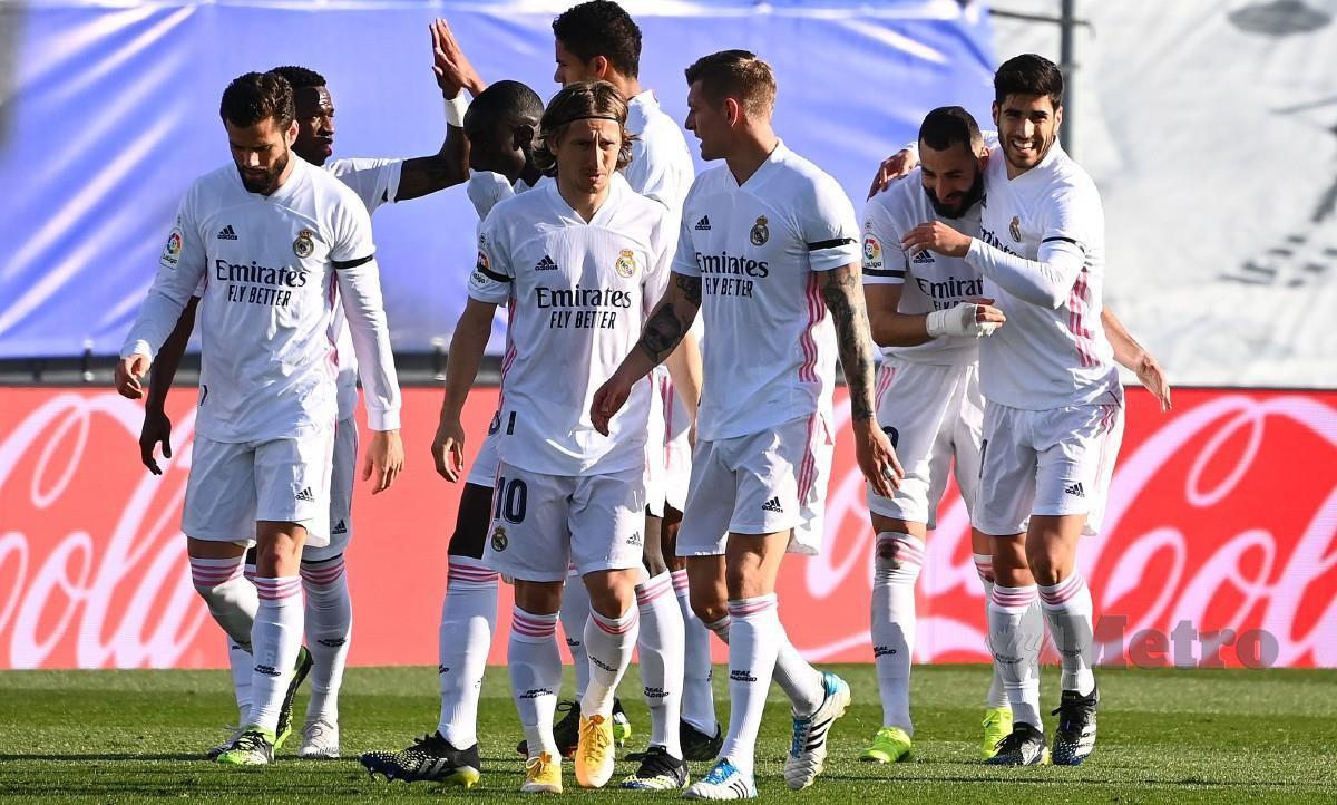 PEMAIN Real Madrid meraih tonik terbaik sebelum beraksi di Liga Juara-Juara selepas mengalahkan Valencia 2-0. FOTO AFP