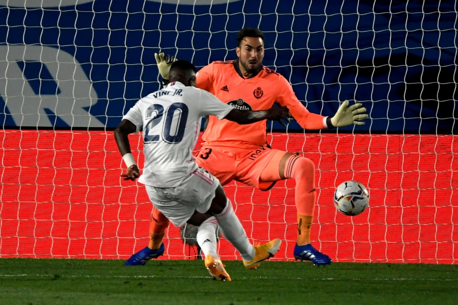 AKSI  Vinicius Junior  menjaringkan gol Madrid. FOTO AFP