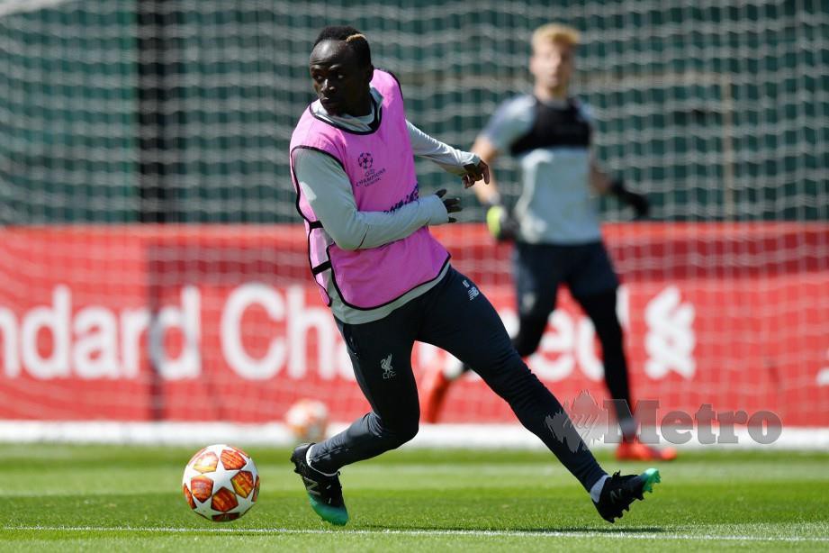 Sadio Mane menjalani latihan di Liverpool. FOTO AFP.
