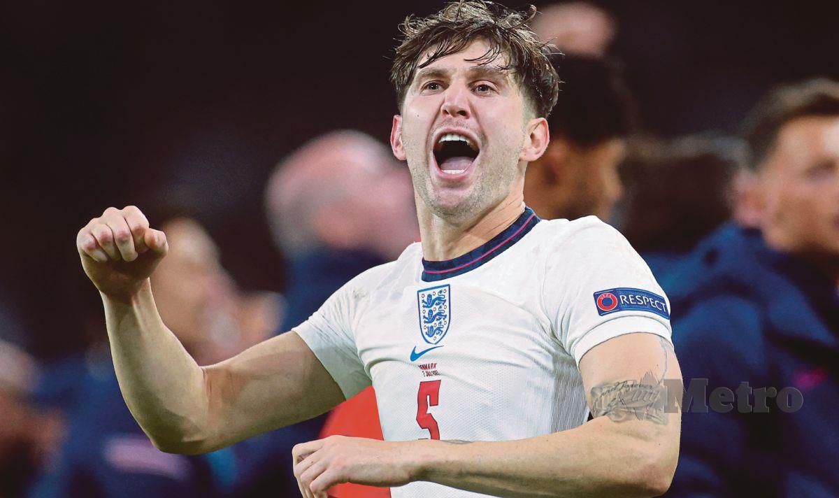 BEK tengah England, John Stones meraikan kejayaan menewaskan Denmark di separuh akhir Euro 2020 di Wembley, Rabu lalu. FOTO AFP