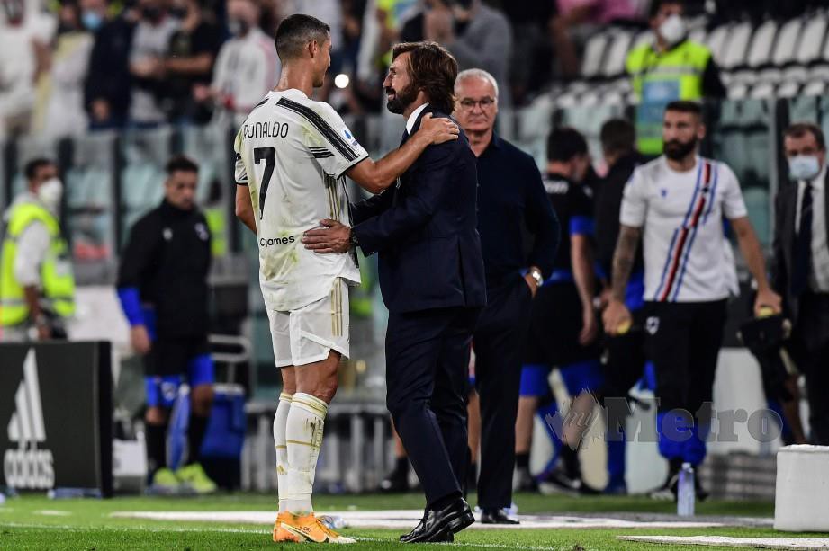 PIRLO menemui Ronaldo selepas tamat perlawanan. FOTO AFP