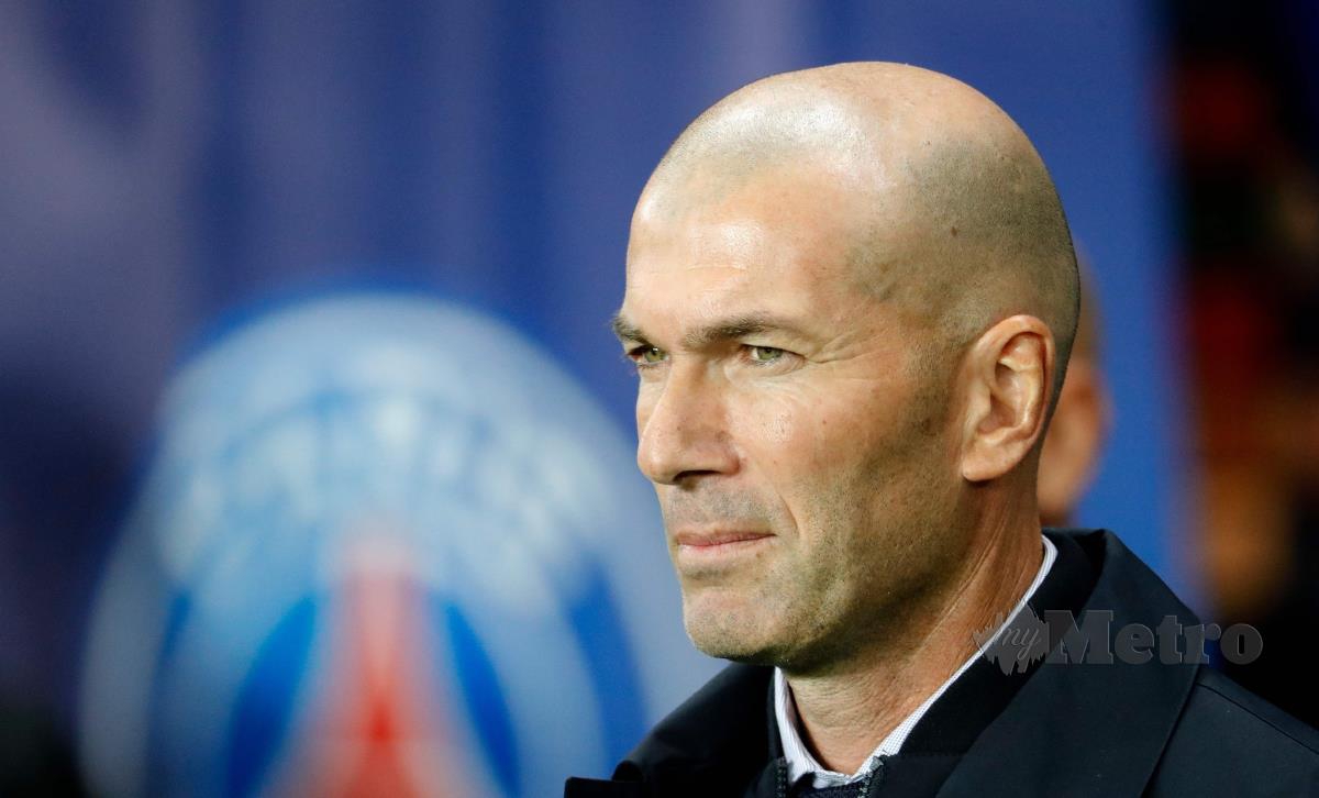 ZINEDINE Zidane dikaitkan dengan jawatan jurulatih PSG, musim depan. FOTO AFP