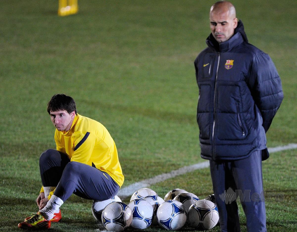 MESSI (kiri) ketika bersama Barca yang dibimbing Guardiola pada 2011. FOTO AFP