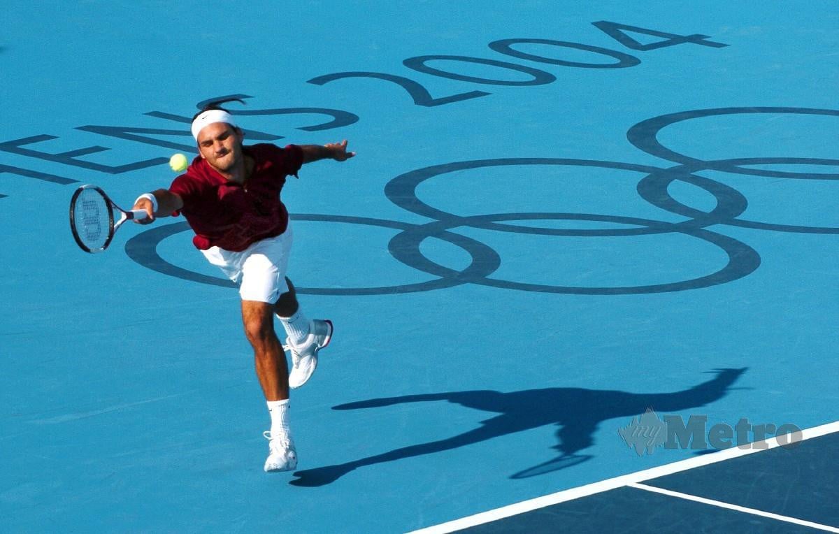 KECEDERAAN lutut yang masih belum pulih memaksa Federer menarik diri daripada Olimpik. FOTO AFP 