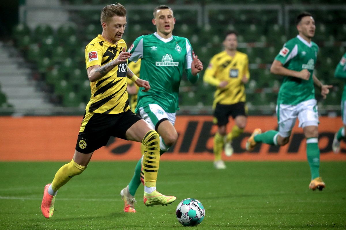 REUS (kiri) berjaya meledakkan gol kemenangan Dortmund ketika mengalahkan Bremen 2-1. FOTO Agensi
