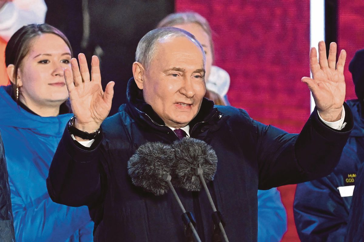 PUTIN berucap di perhimpunan di Moscow. FOTO AFP