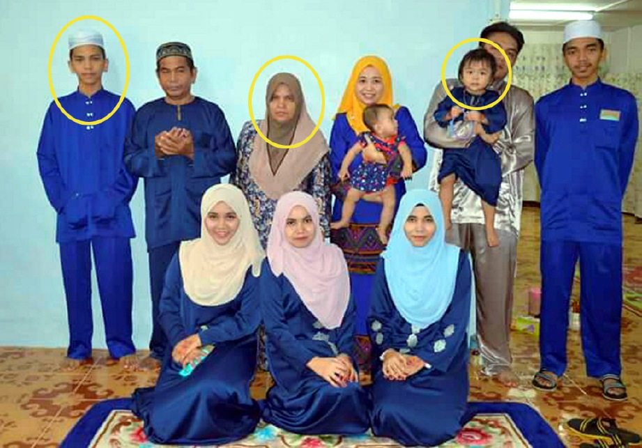 GAMBAR keluarga arwah Muhamad Saiful (berdiri, kiri), Paridah (berdiri, tiga kiri) dan Nur Assyifa' (didukung, dua kanan). FOTO ihsan keluarga Sidik Awang