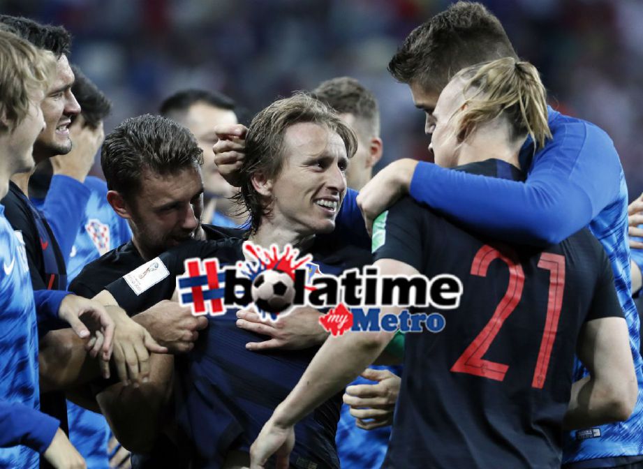 LUKA Modric meraikan kemenangan bersama rakan sepasukan. Foto EPA-EFE