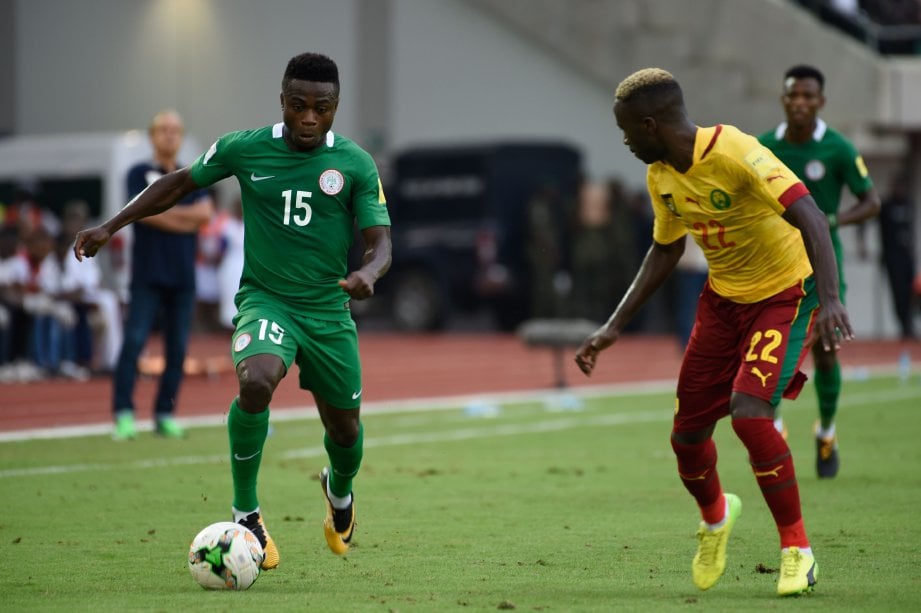 MOSES (kiri) jaring gol tunggal Nigeria. -Foto AFP