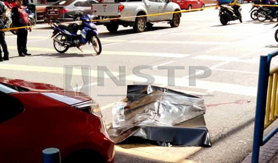 LELAKI maut ditembak polis di Jalan Ria berhampiran Kompleks Tun Abdul Razak (KOMTAR). FOTO ihsan Polis