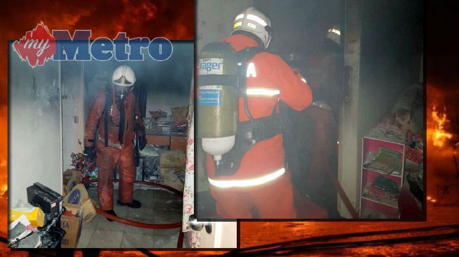 Anggota bomba memadam kebakaran di dalam bilik yang terbakar. Foto ihsan bomba