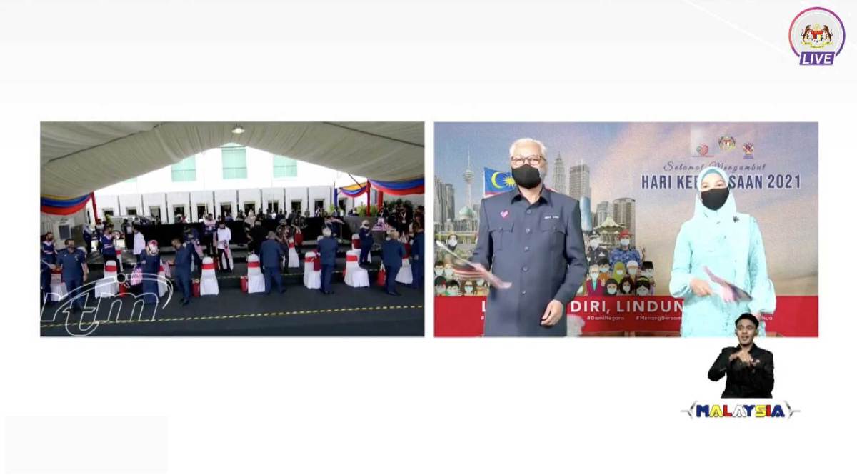 ISMAIL Sabri dan isteri hadir Sambutan Hari Kebangsaan 2021 di Dataran Pahlawan Negara, Putrajaya, secara dalam talian. FOTO RTM