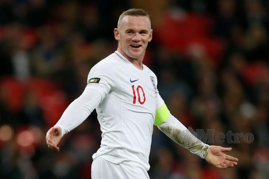 Wayne Rooney ketika beraksi mewakili England. FOTO File AFP