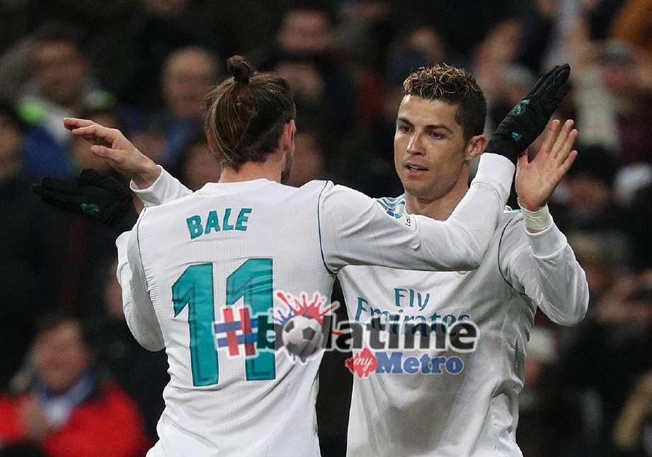 RONALDO meraikan gol kelima Real sekali gus melengkapkan hatriknya bersama Gareth Bale. -Foto Reuters
