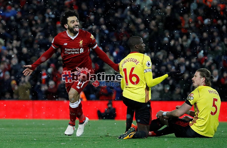 AKSI Salah meraikan gol keempat Liverpool dan hatrik pertamanya di Anfield. -Foto Reuters