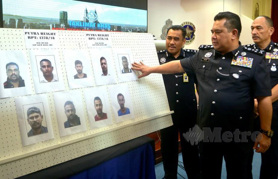 Huzir (tengah) menunjukkan gambar sembilan individu yang diminta tampil membantu pihak polis menyiasat kes kematian Muhammad Adib di IPK Selangor, Shah Alam hari ini. Foto Faiz Anuar 