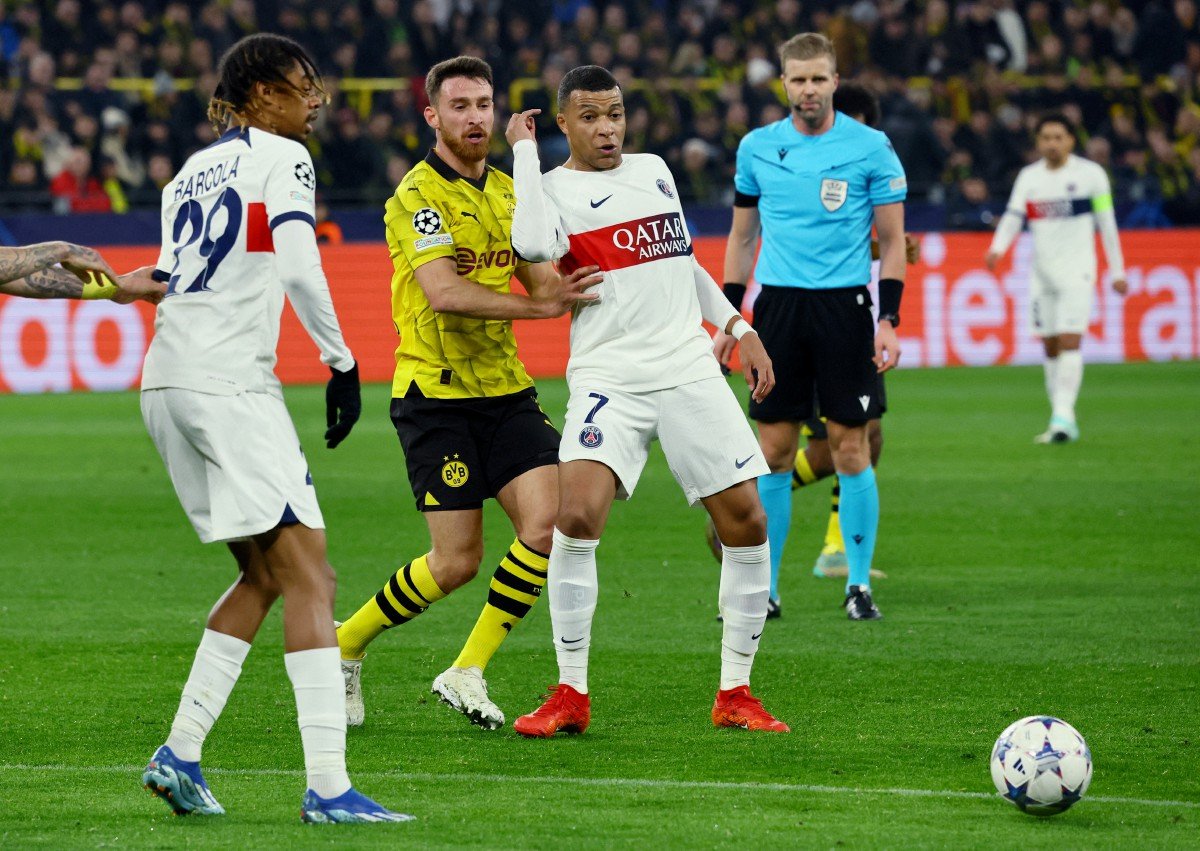 PSG menentang Dortmund yang berakhir dengan keputusan seri 1-1. -FOTO Reuters 