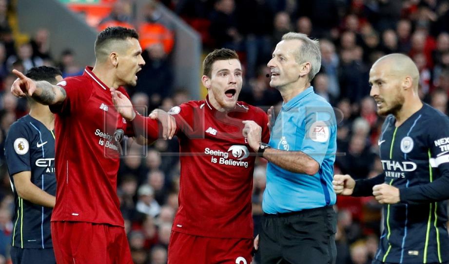 REAKSI tegang antara pemain Man City dan Liverpool ketika aksi di Stadium Anfield. FOTO Reuters