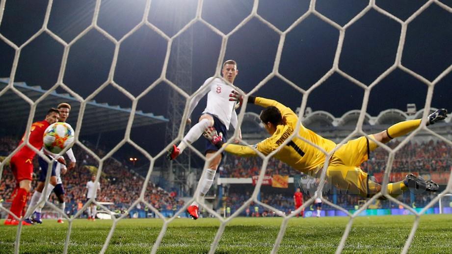 AKSI Barkley menjaringkan gol keduanya ketika menentang Montenegro di  Stadium Podgorica City. - FOTO Reuters