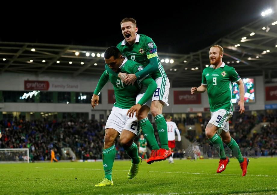  Pemain Ireland Utara, Josh Magennis meraikan jaringan kemenangan ketika perlawanan menentang Belarus pada kelayakan Euro 2020. 