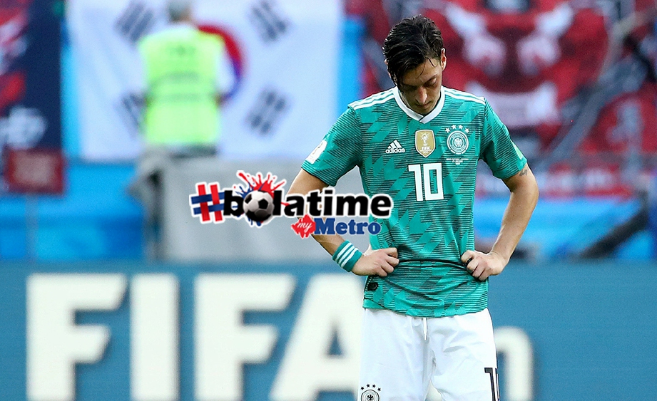REAKSI sedih pemain Jerman, Mesut Ozil selepas Jerman tersingkir dari 16 pasukan terakhir. FOTO Reuters