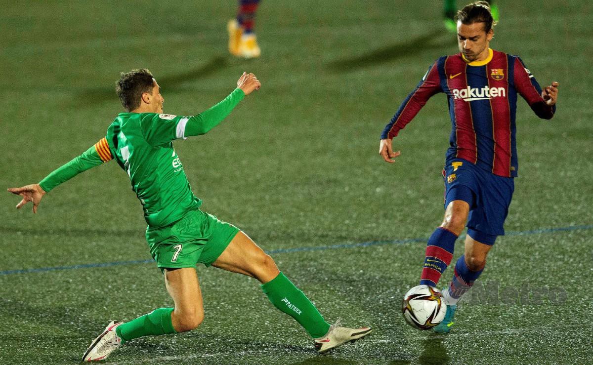GRIEZMANN turut beraksi dalam saingan Copa del Rey ketika Barcelona mengalahkan Cornella. FOTO EPA