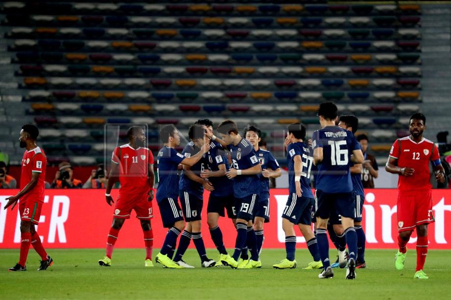 PEMAIN Jepun meraikan kemenangan ke atas Oman. FOTO/AFP
