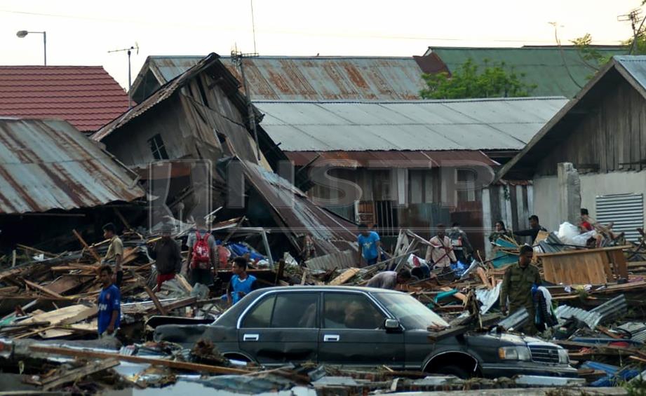 KEADAAN musnah di Palu, Sulawesi selepas dibadai tsunami. FOTO AFP
