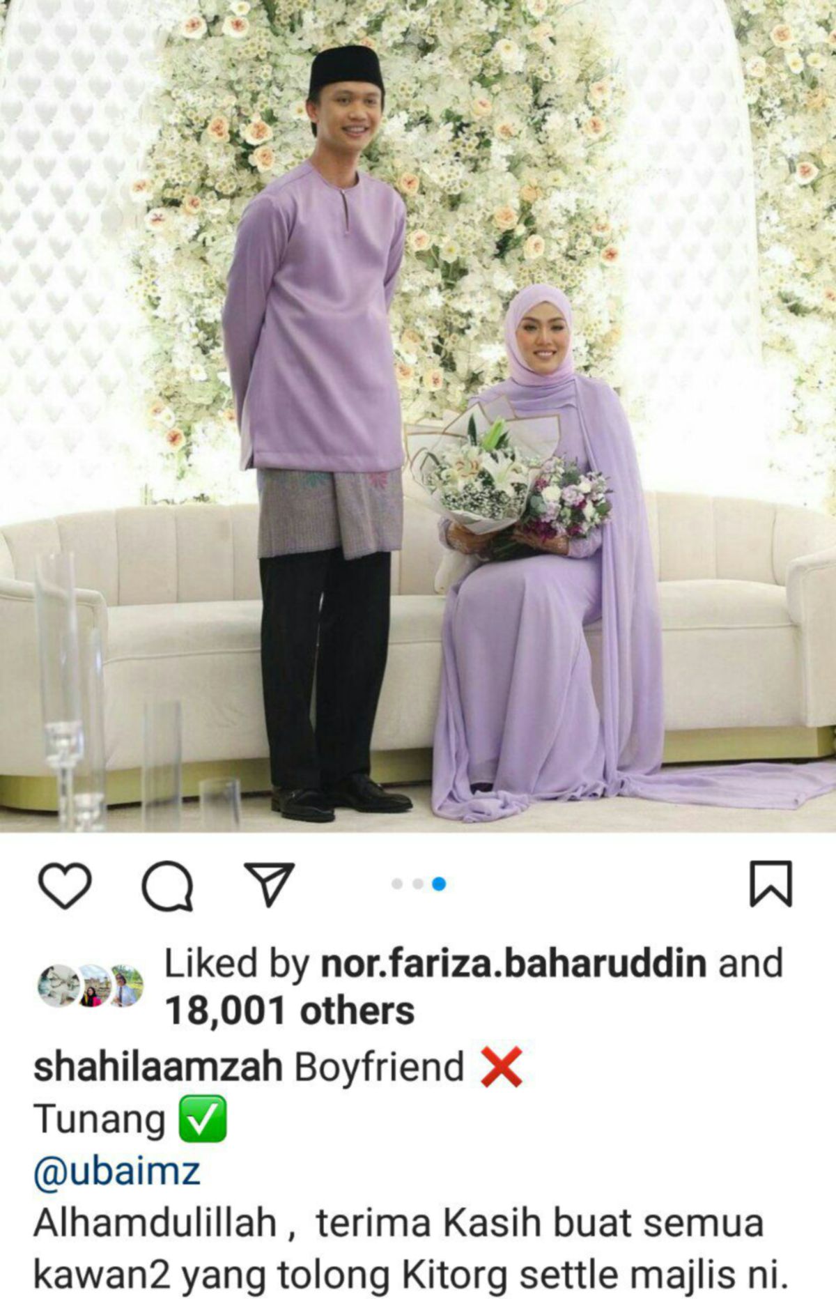 SHILA berkongsi gambarnya berpakaian sedondon berwarna ungu bersama Ubai sambil tersenyum di pelamin yang direka khas untuk majlis mereka. FOTO Instagram shahilaamzah