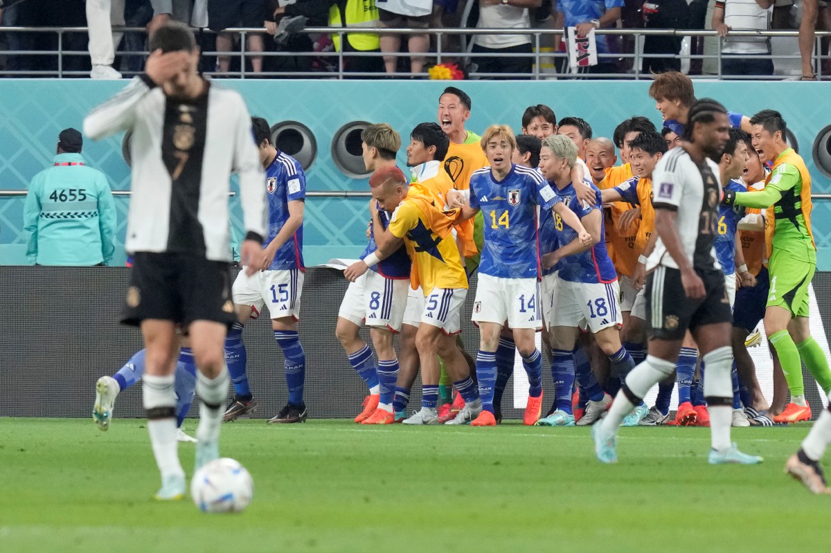 Pemain Jepun Ritsu Doan meraikan jaringan menentang Jerman pada aksi Kumpulan E Piala Dunia. FOTO AP