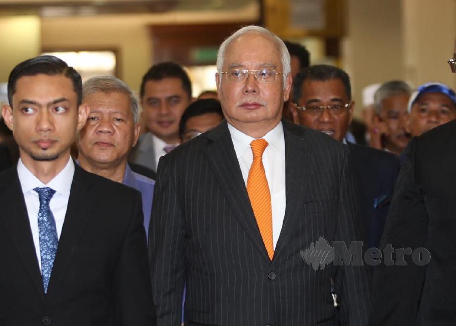 BEKAS Perdana Menteri, Datuk Seri Najib Razak, meninggalkan Mahkamah Tinggi Jenayah 1 untuk mendengar keputusan kes SRC International di Kompleks Mahkamah Kuala Lumpur. FOTO MOhamad Shahril Badri Saali