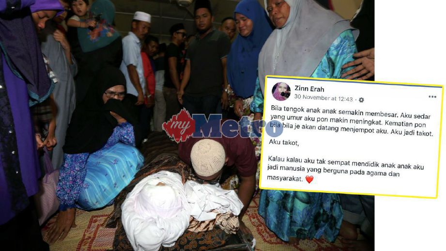 Ahli keluarga dan saudara melihat jenazah Allahyarham Zinnirah dan anak bongsunya, Nur Alia Humairah, tiga bulan yang terbabit dalam kemalangan maut di kediaman keluarga di Kampung Mengkibol, Kluang. FOTO Hairul Anuar Rahim 