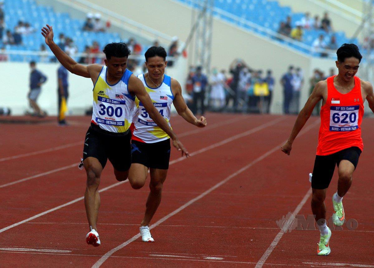 ARSYAD (kiri) ketika beraksi dalam acara akhir 200m. FOTO Hairul Anuar Rahim 