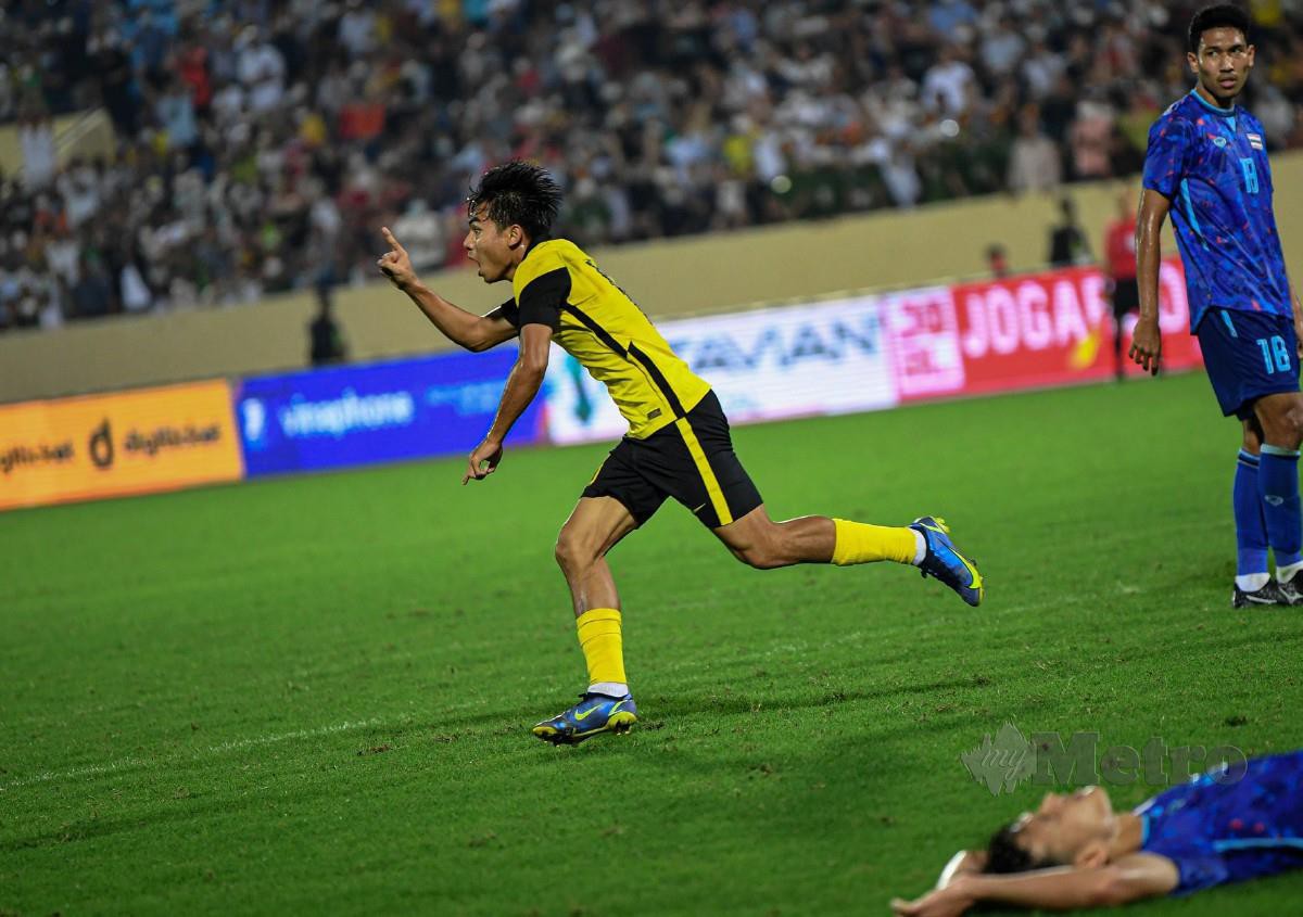 NUR Azfar meraikan gol jaringannya ketika menentang Thailand. FOTO Bernama