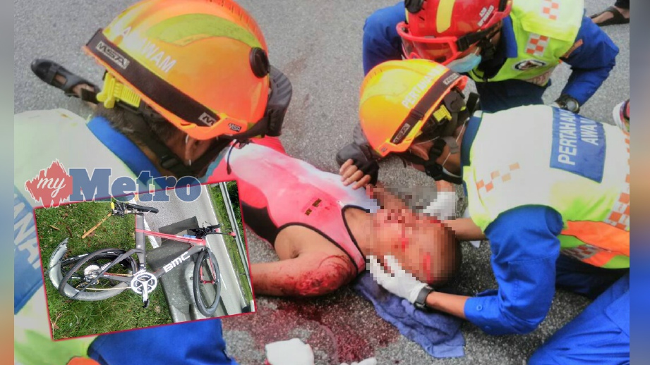 ANGGOTA APM memberi rawatan kecemasan kepada Azran selepas basikalnya (gambar kecil) dirempuh sebuah kereta dalam kemalangan di Jalan Tuanku Abdul Halim, Kuala Lumpur, hari ini. FOTO Ihsan Pembaca