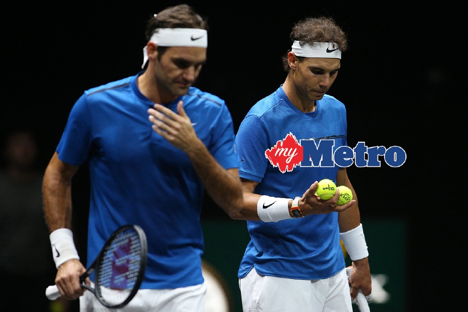 NADAL (kanan) bersama Federer tiada masalah atasi pasangan Querrey dan  Sock- Foto EPA