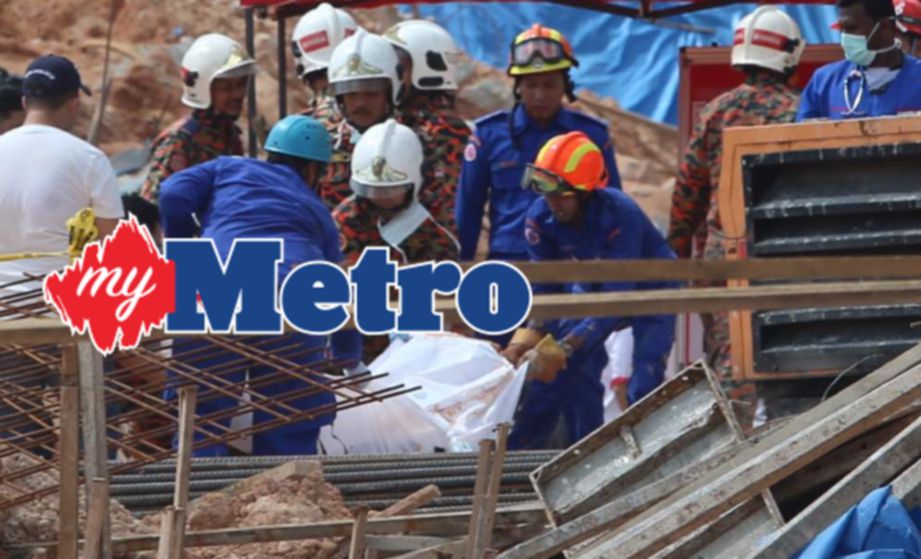 ANGGOTA penyelamat menemui mayat dalam runtuhan di tapak pembinaan Lembah Permai, Tanjung Bungah. FOTO Danial Saad