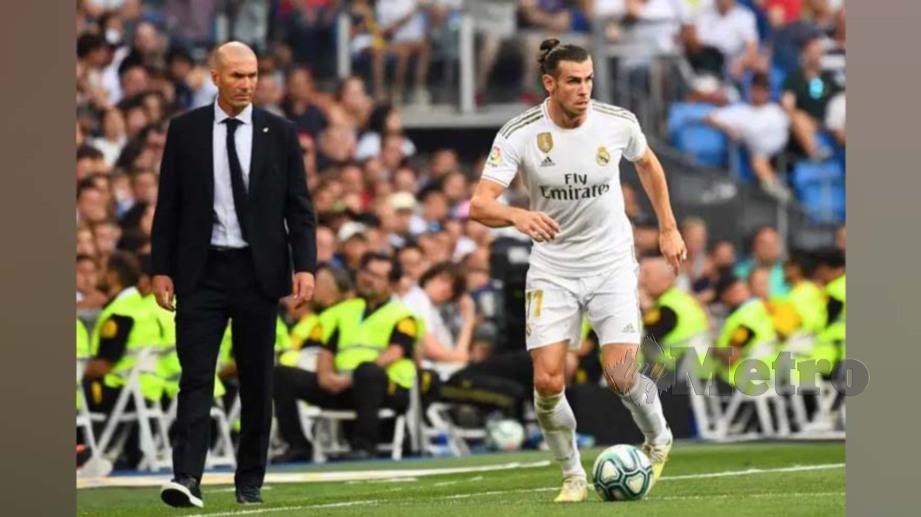 Zidane (kiri) lega Bale mahu kekal di Real. FOTO Agensis