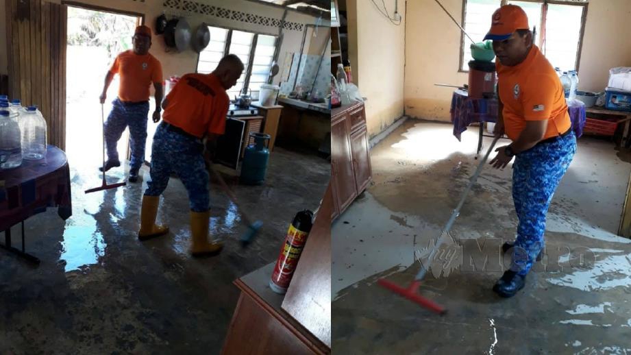 ANGGOTA APM membantu membersihkan rumah penduduk yang dilanda banjir. FOTO ihsan APM