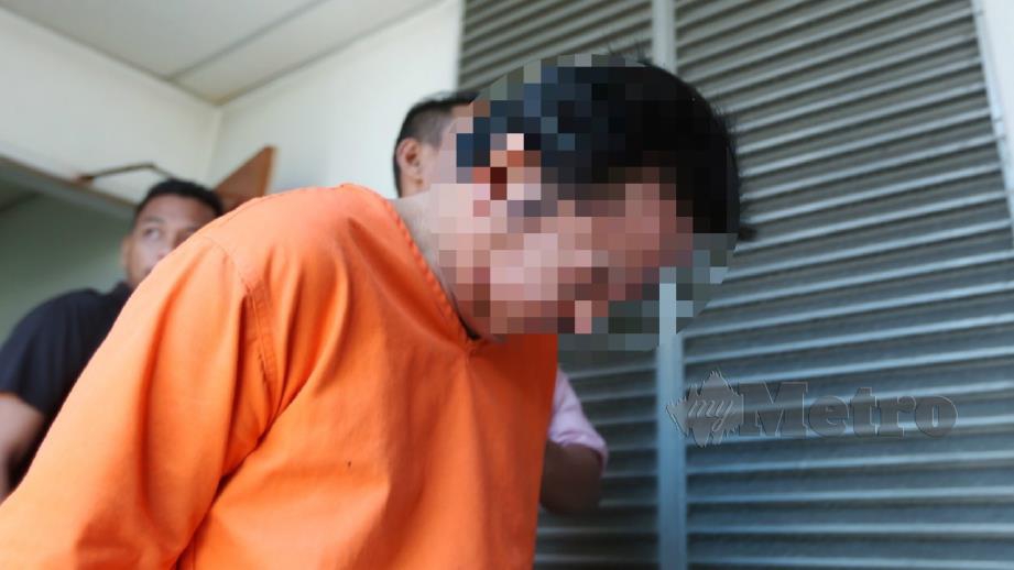 TERTUDUH mengaku merogol, meliwat dan menghasilkan video pornografi anak kandungnya yang juga OKU di Mahkamah Sesyen Kuala Terengganu. FOTO IMRAN MAKHZAN