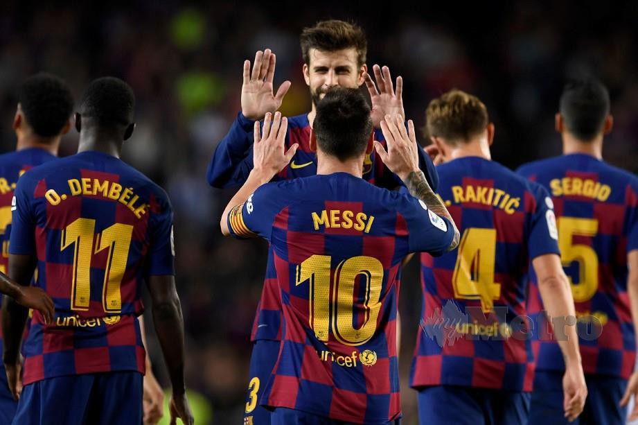 BARCELONA menampilkan Lionel Messi, pemain terbaik tahunan FIFA. — FOTO AFP