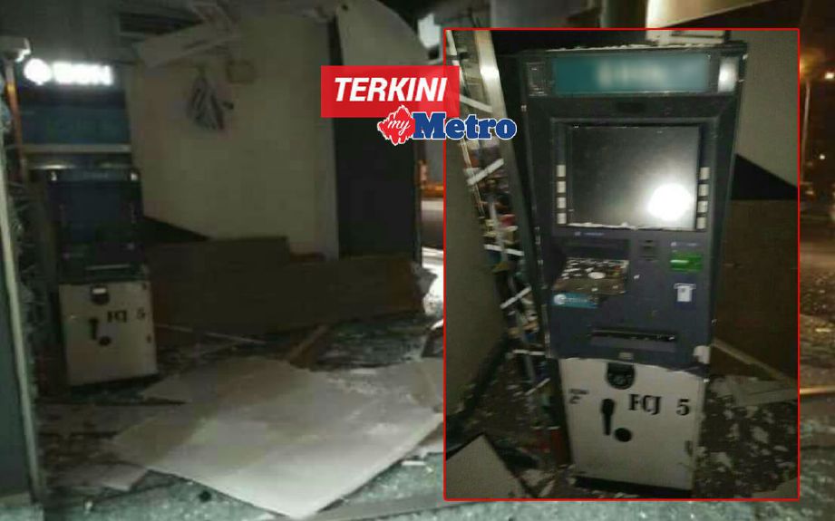 ATM yang cuba diletupkan suspek dengan bom buatan sendiri di RTC Napoh. FOTO ihsan pembaca